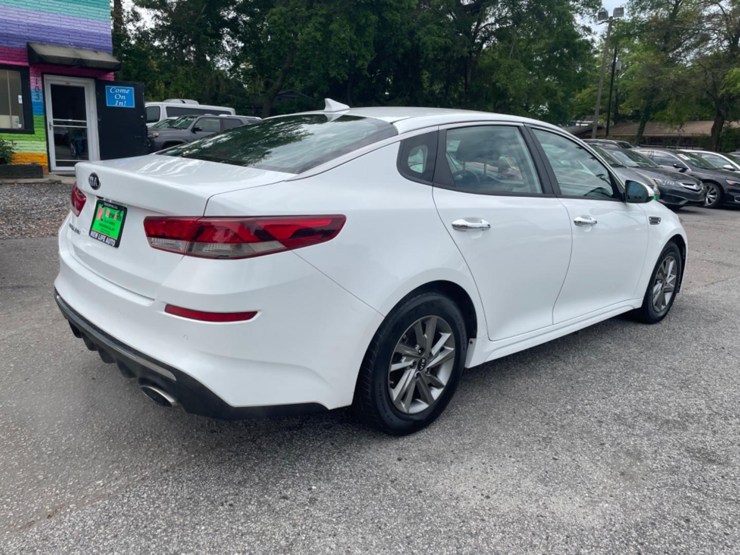 2019 WHITE KIA OPTIMA LX (5XXGT4L38KG) with an 2.4L engine, Automatic transmission, located at 5103 Dorchester Rd., Charleston, SC, 29418-5607, (843) 767-1122, 36.245171, -115.228050 - Spacious interior with AUX/USB/Bluetooth, Backup Camera, Power Windows, Power Locks, Power Mirrors, Keyless Entry, Alloy Wheels. Local Trade-in! 124k miles Located at New Life Auto Sales! 2023 WINNER for Post & Courier's Charleston's Choice Pre-owned Car Dealer AND 2018-2024 Top 5 Finalist for Char - Photo#6